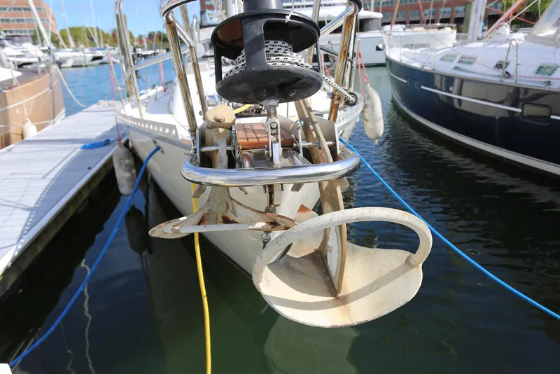 Slide: The Image of Pacific Seacraft Crealock 40 sailboat anchored at marina, showcasing anchor and bow details. - 22