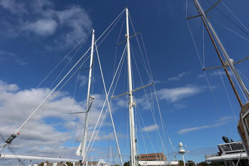 Slide: The Image of Masts of a 2004 Pacific Seacraft Crealock 40 sailboat against a clear blue sky. - 23
