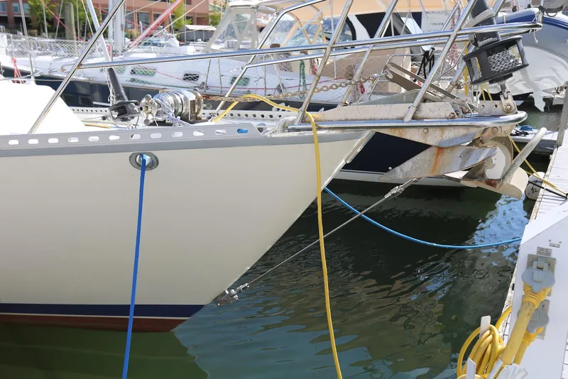 Slide: The Image of Bow of 2004 Pacific Seacraft Crealock 40 sailboat docked, with anchor and mooring lines. - 24