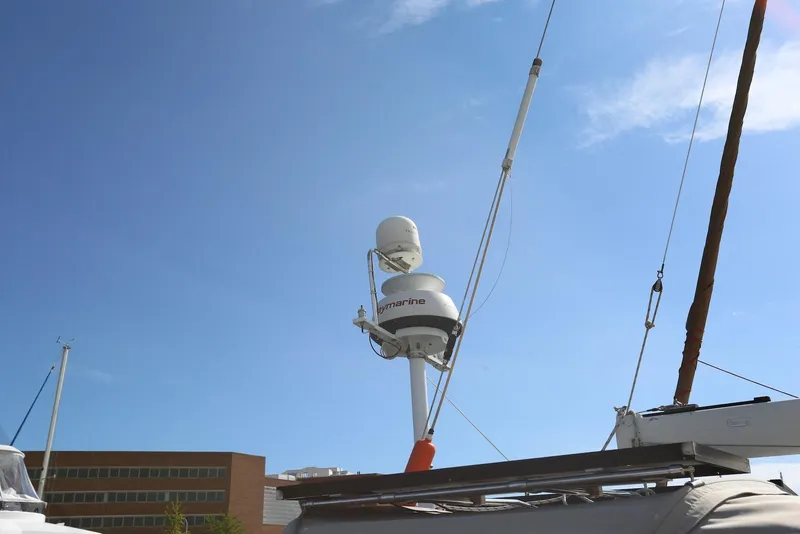 Slide: The Image of Radar equipment on a 2004 Pacific Seacraft Crealock 40 sailboat under clear blue sky. - 25
