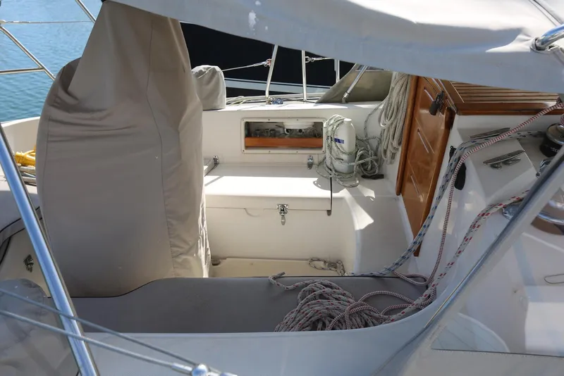 Slide: The Image of Cockpit of 2004 Pacific Seacraft Crealock 40 sailboat with covered helm and ropes. - 27