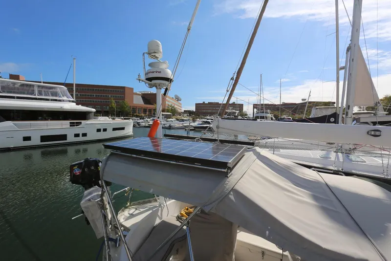 Slide: The Image of 2004 Pacific Seacraft Crealock 40 sailboat with solar panels docked in marina. - 28