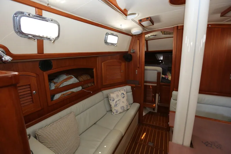 Slide: The Image of Interior of 2004 Pacific Seacraft Crealock 40 sailboat with wooden finish and cozy seating. - 32
