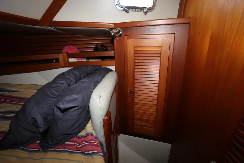 Slide: The Image of Cozy cabin interior of 2004 Pacific Seacraft Crealock 40 sailboat with wooden cabinetry. - 36