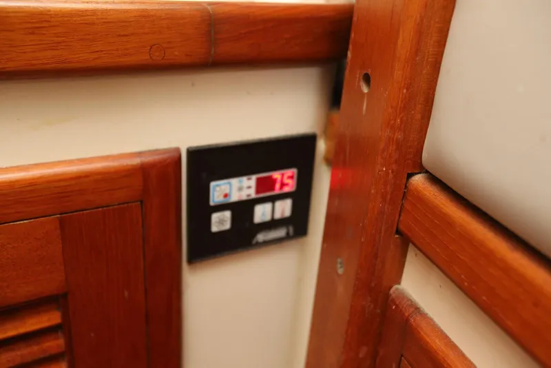 Slide: The Image of Control panel on a 2004 Pacific Seacraft Crealock 40 sailboat interior. - 39