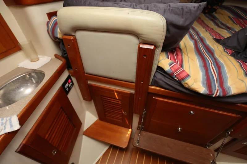 Slide: The Image of Interior of 2004 Pacific Seacraft Crealock 40 yacht with bed, sink, and wooden cabinetry. - 41