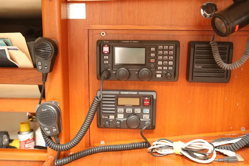 Slide: The Image of Radio equipment on a 2004 Pacific Seacraft Crealock 40 sailboat, featuring Icom communication devices. - 45