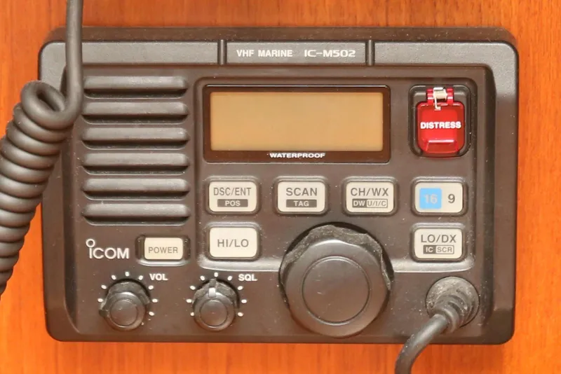 Slide: The Image of VHF Marine IC-M502 radio on 2004 Pacific Seacraft Crealock 40, featuring distress button. - 47