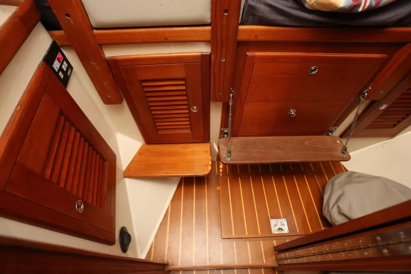 Slide: The Image of Interior of 2004 Pacific Seacraft Crealock 40 sailboat with wooden cabinetry and flooring. - 52