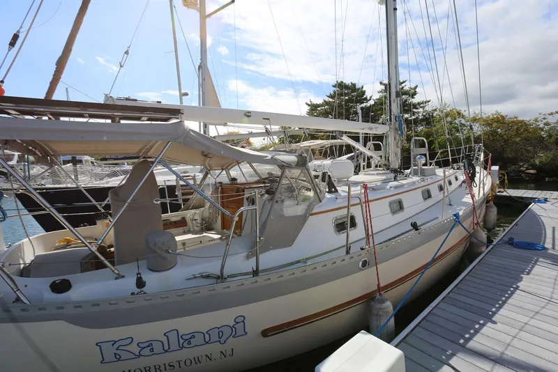 Slide: The Image of 2004 Pacific Seacraft Crealock 40 sailboat docked at marina, sunny day. - 8