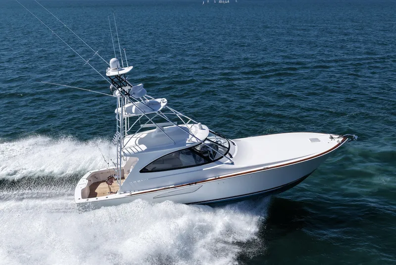 Slide: The Image of 2024 Viking 48 Sport Tower yacht cruising on open water. - 3