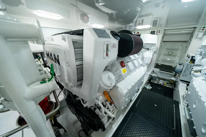 Slide: The Image of Engine room of 2024 Viking 48 Sport Tower yacht, featuring a powerful MAN engine. - 72