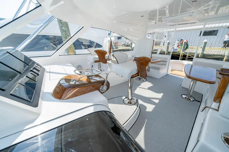 Slide: The Image of Luxurious interior of 2024 Viking 48 Sport Tower yacht with modern seating and controls. - 39