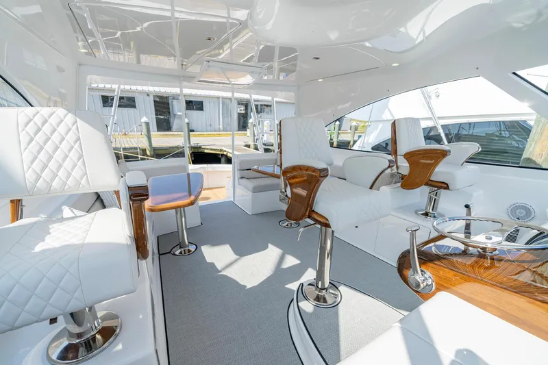 Slide: The Image of Luxurious interior of 2024 Viking 48 Sport Tower yacht with elegant seating and modern design. - 44
