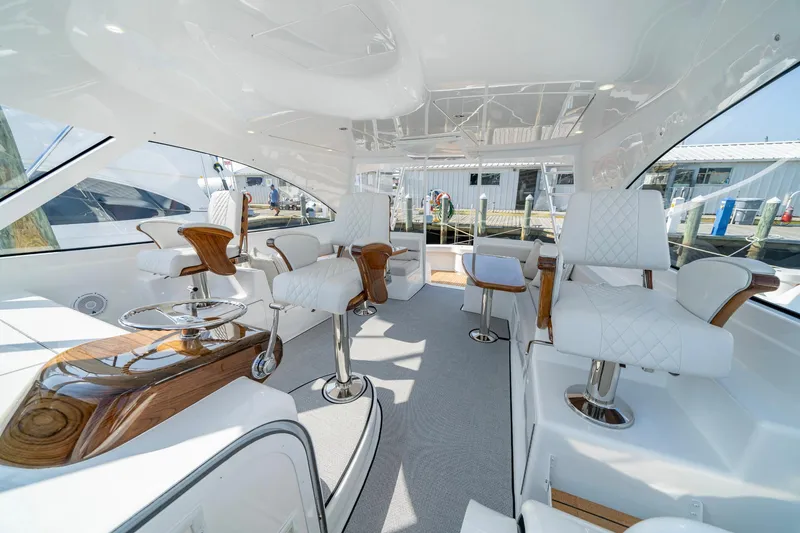 Slide: The Image of Luxurious interior of 2024 Viking 48 Sport Tower yacht with elegant seating and modern design. - 45