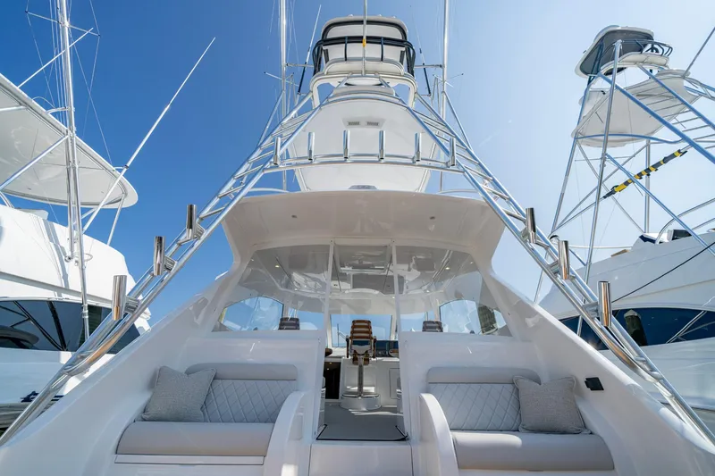 Slide: The Image of 2024 Viking 48 Sport Tower yacht with sleek design and luxurious seating. - 49