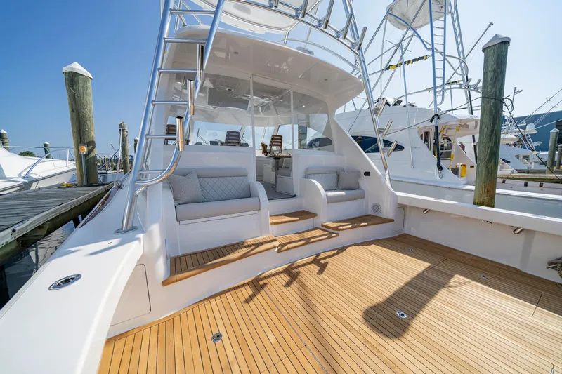 Slide: The Image of 2024 Viking 48 Sport Tower yacht with spacious deck and seating area. - 47