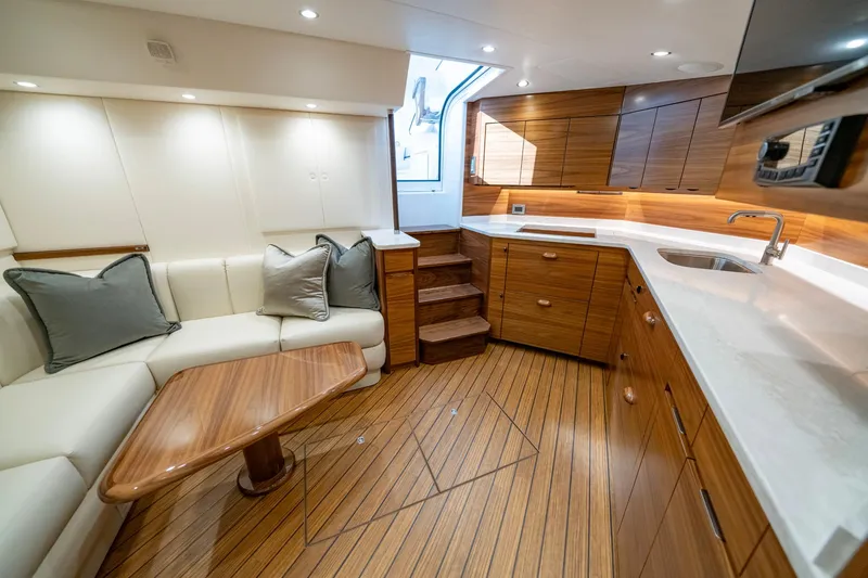 Slide: The Image of Luxurious interior of 2024 Viking 48 Sport Tower yacht with wood accents and modern design. - 56