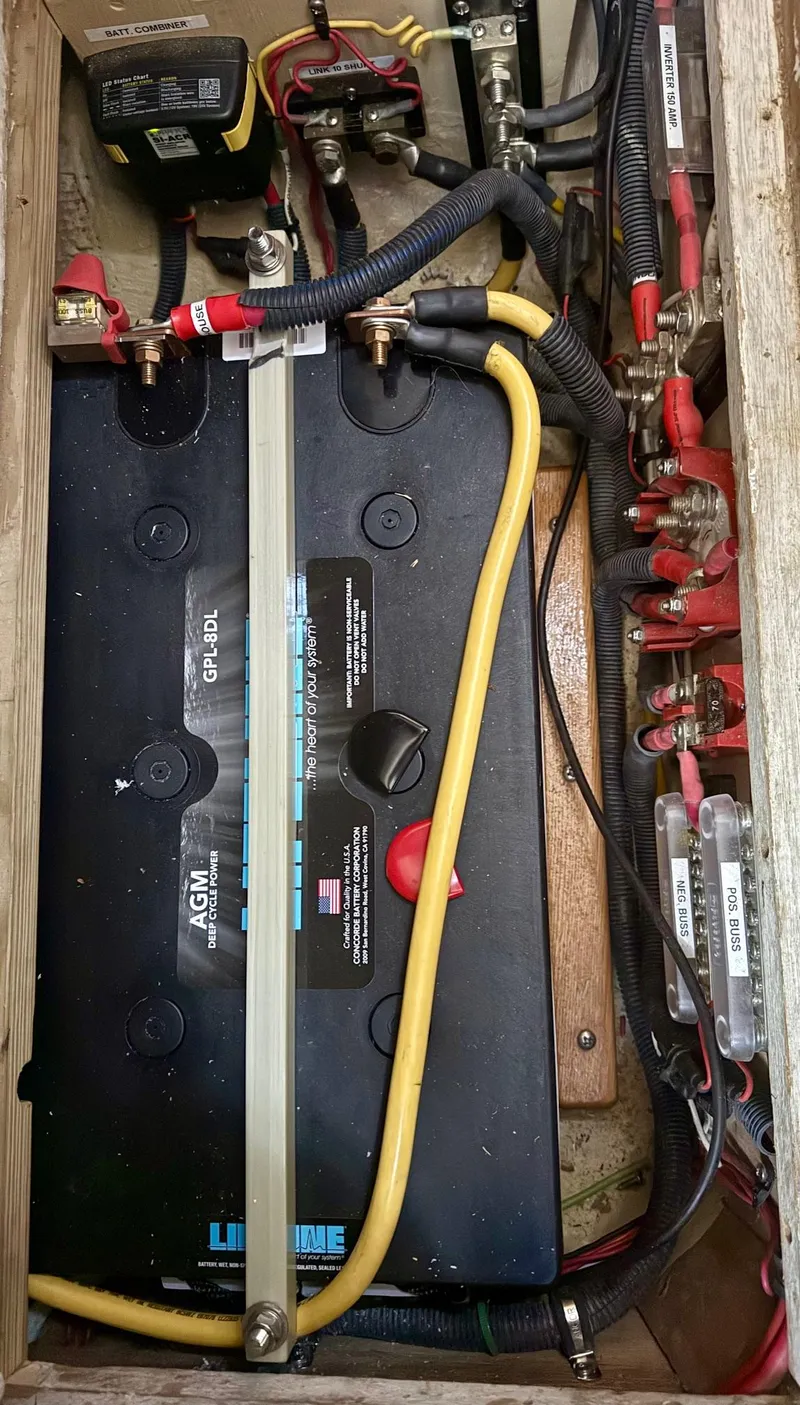 Slide: The Image of Battery compartment of a 1981 Bristol 35.5, featuring AGM battery and wiring connections. - 15