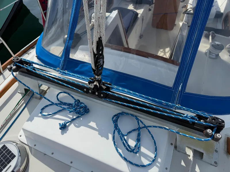Slide: The Image of 1981 Bristol 35.5 sailboat deck with blue rigging and protective canopy. - 21