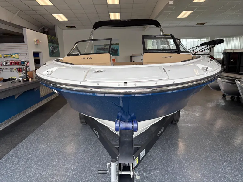 Slide: The Image of 2025 Sea Ray SPX 190 boat displayed indoors, showcasing sleek design and modern features. - 1