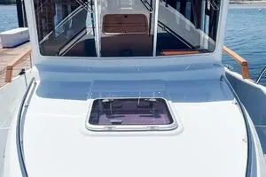 Slide: The Image of 2022 Targa 32 boat docked, showcasing sleek design and spacious deck. - 11