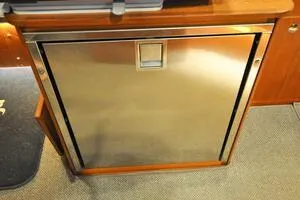 Slide: The Image of Stainless steel refrigerator on 2022 Targa 32 boat interior. - 17
