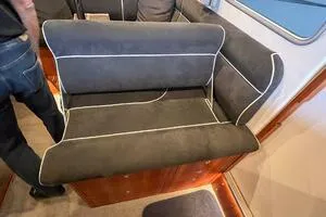 Slide: The Image of 2022 Targa 32 interior seating with dark upholstery and white piping. - 20