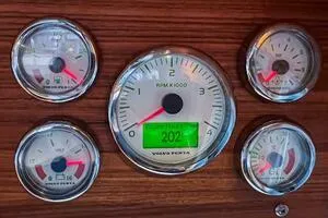 Slide: The Image of Dashboard gauges of a 2022 Targa 32 boat, featuring Volvo Penta RPM display. - 27