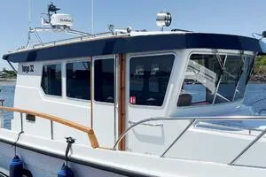 Slide: The Image of 2022 Targa 32 boat with sleek design, docked by the water. - 3