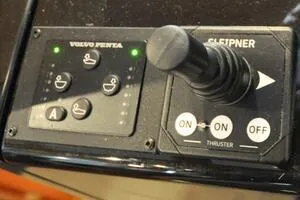 Slide: The Image of Control panel with joystick and buttons on a 2022 Targa 32 boat. - 31