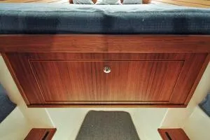 Slide: The Image of 2022 Targa 32 interior with wooden cabinetry and cushioned seating. - 34