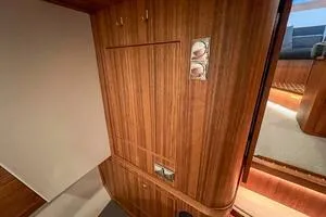Slide: The Image of Interior of 2022 Targa 32 boat with wooden paneling and modern design. - 37