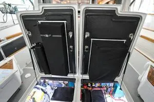 Slide: The Image of 2022 Targa 32 boat interior with open engine compartments, showcasing modern design and functionality. - 38