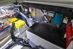 Slide: The Image of Engine compartment of 2022 Targa 32 boat, showcasing wiring and mechanical components. - 43