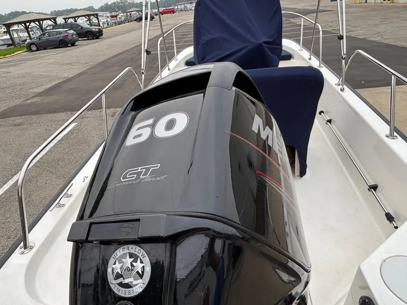 Slide: The Image of 2016 Boston Whaler 150 Montauk with Mercury 60 HP engine at marina. - 4