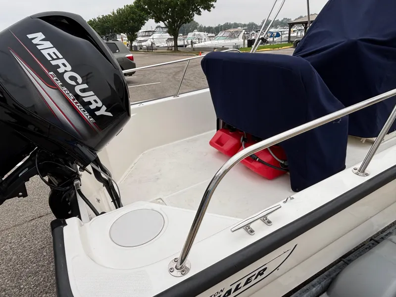 Slide: The Image of 2016 Boston Whaler 150 Montauk with Mercury FourStroke engine at marina. - 9