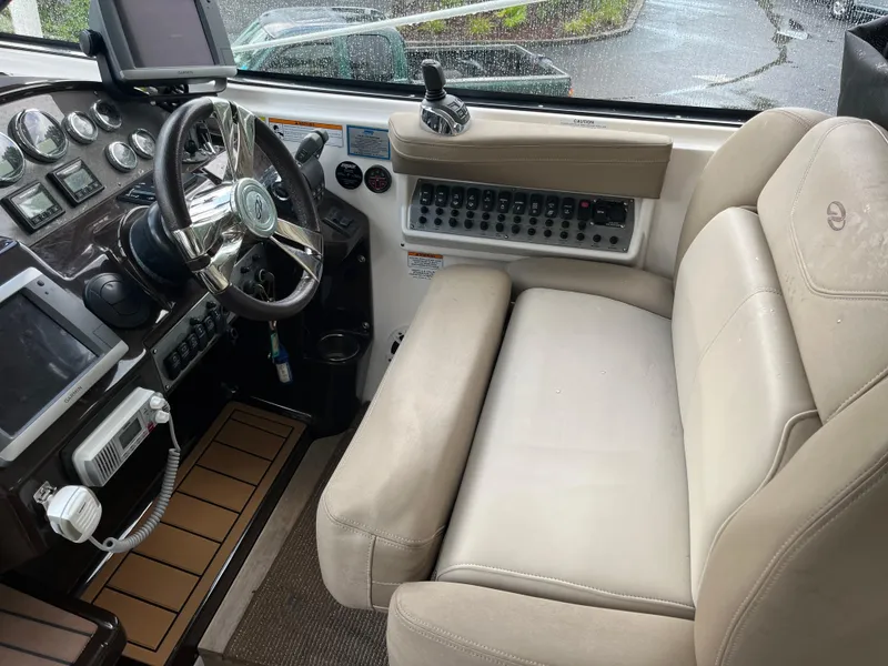 Slide: The Image of Interior cockpit of 2014 Regal 35 Sport Coupe with steering wheel and control panel. - 18