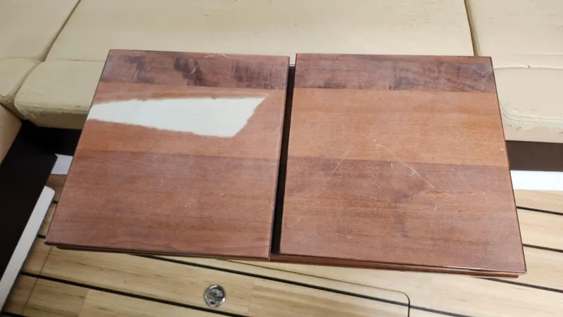 Slide: The Image of Wooden table surface on a 2014 Regal 35 Sport Coupe boat interior. - 30