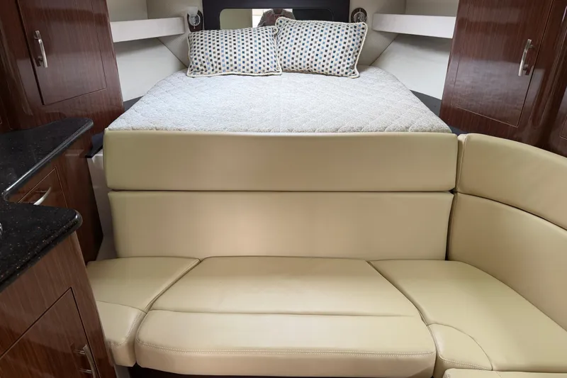Slide: The Image of 2014 Regal 35 Sport Coupe docked, showcasing spacious deck and seating area. - 4