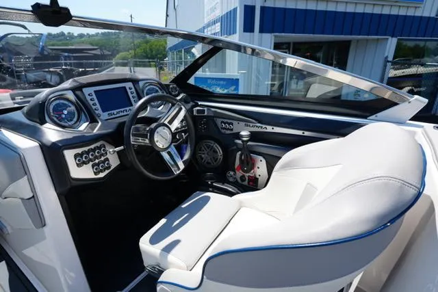 Slide: The Image of 2016 Supra SA400-550 boat interior with steering wheel and dashboard controls. - 10