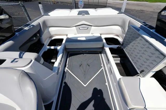 Slide: The Image of 2016 Supra SA400-550 boat interior with open storage compartments and sleek seating design. - 14