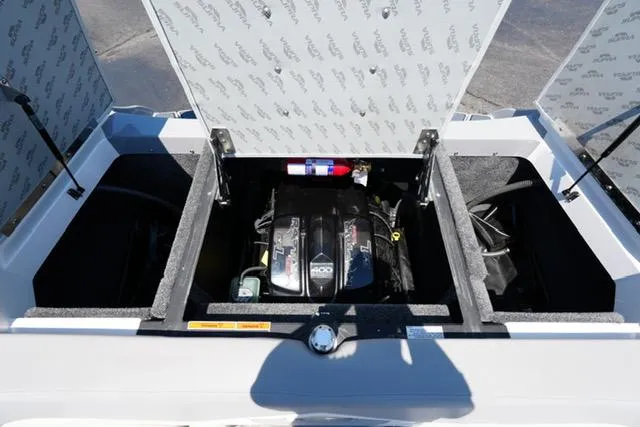 Slide: The Image of Engine compartment of a 2016 Supra SA400-550 boat with open hatches and visible fire extinguisher. - 15