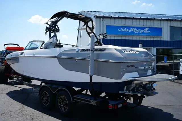 Slide: The Image of 2016 Supra SA400-550 boat on trailer outside dealership, side view. - 5
