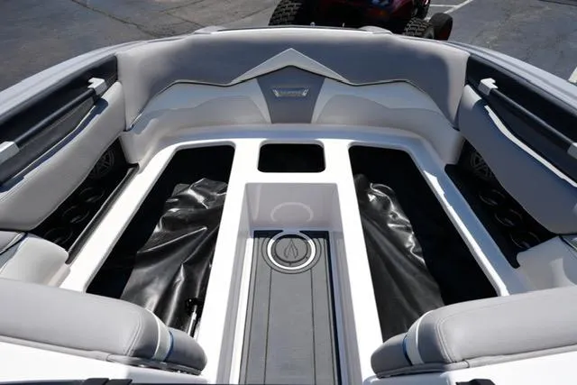 Slide: The Image of 2016 Supra SA400-550 boat interior with sleek seating and storage compartments. - 7