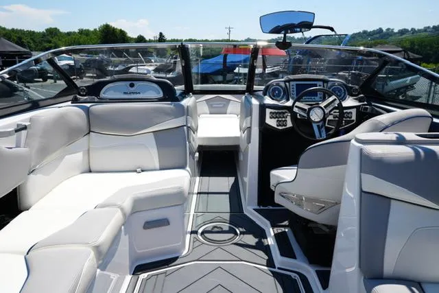 Slide: The Image of 2016 Supra SA400-550 boat interior with luxurious seating and modern dashboard. - 9