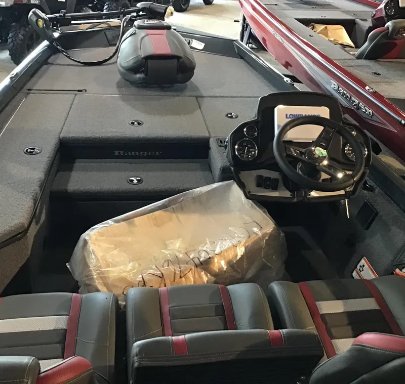 Slide: The Image of 2025 Ranger RT178 boat interior with steering wheel and seating. - 2