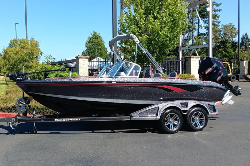 The Image of 2025 Ranger 620FS Cup Equipped boat on trailer, parked outdoors. - 0