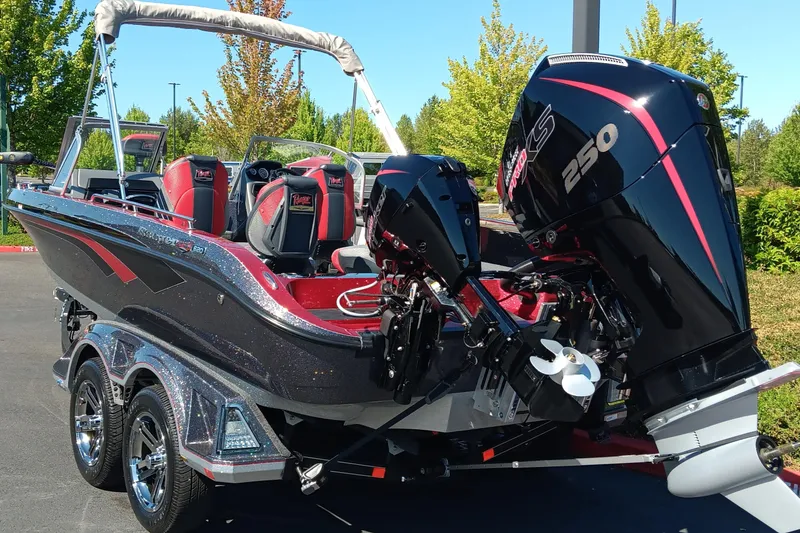 Slide: The Image of 2025 Ranger 620FS Cup Equipped boat with powerful 250 engine, parked outdoors. - 6