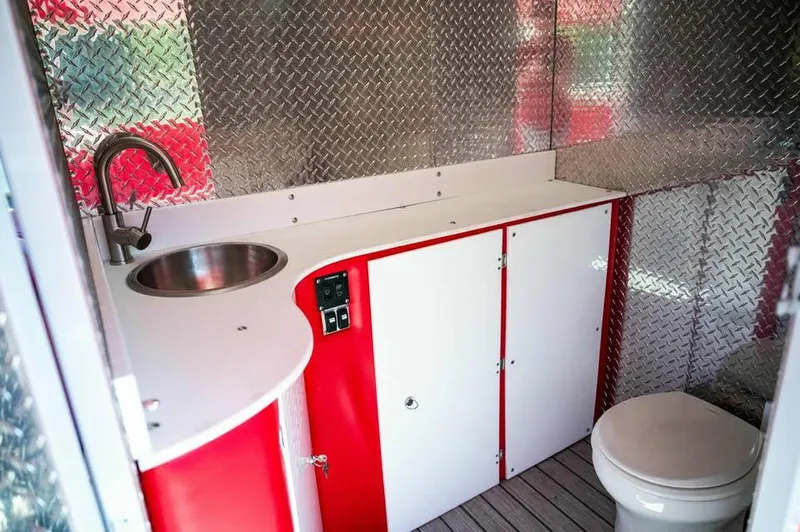 Slide: The Image of Interior of 2024 Aloha Pontoon 50' Water Taxi with sink and toilet. - 13